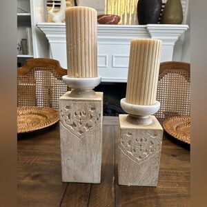 Two wood and marble pillar candle holders